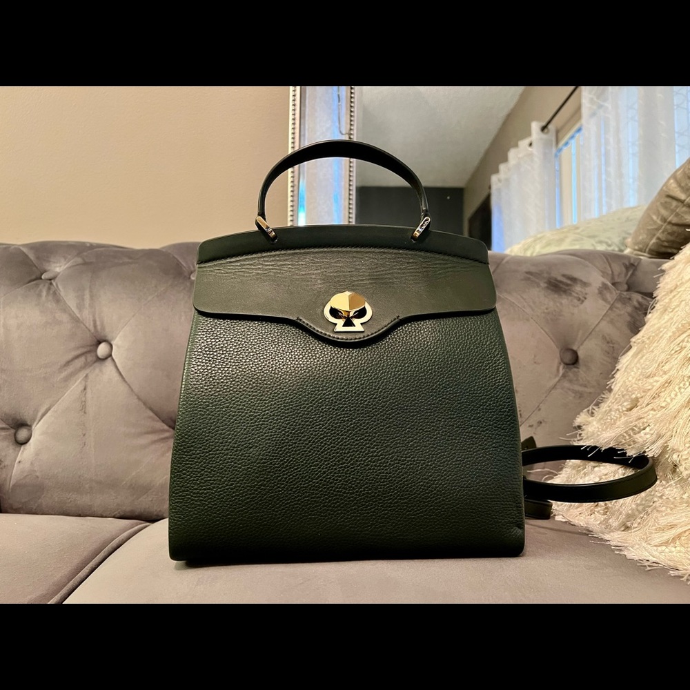 stylish backpack olive green with gold hardware and baby pink suede interior.